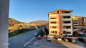 a street with cars parked next to a building at Le Persiane Azzurre est in Albiano