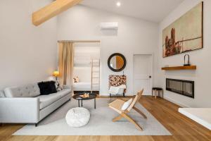 a living room with a couch and a table at Camp Jackalope - Outdoor Trails - Fire Pit - Views in Wimberley