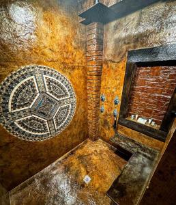 a room with a mosaic on the wall with a window at The Miner's Getaway in Lead SD in Lead +15 photos