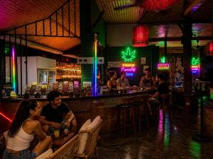 a group of people sitting at a bar at Noahs Ark in Lamai +10 photos
