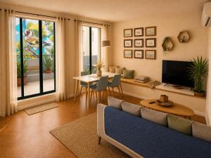a living room with a couch and a table at Rotas B in St. Julianʼs