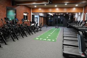 a gym with rows of chairs and a green floor at Best Western Bolholt Country Park Hotel in Bury +109 photos