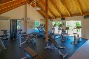 a gym with several treadmills and exercise bikes at Selkie Village in Wells