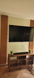 a large flat screen tv on a wall at Confortable apartaestudio en Ipiales in Ipiales