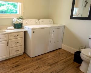 a white washer and dryer in a bathroom at Riverview, 5BR, Hot tub, Fireplace, Arcade Game in Minneiska