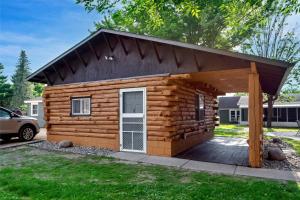a log cabin with a pitched roof at Big River Escape Riverside Cabins in Buffalo City