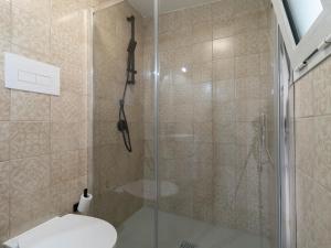 a bathroom with a glass shower with a toilet at Zia Elisa Mare e Comfort - Tertenia in Tertenìa