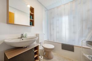 a bathroom with a sink and a toilet at Kleeblatt in Bad Wildbad +22 photos