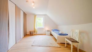 a small bedroom with a bed and a window at Ferienwohnung Kaufmann 3 in Rabenkirchen-Faulück