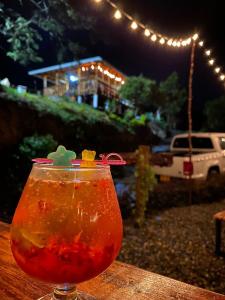 a drink sitting on top of a wooden table at La Cima Bachué in Ubaque