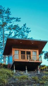 a small house on top of a hill at La Cima Bachué in Ubaque +23 photos
