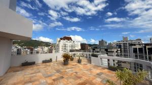 a balcony with a view of a city at Rio Branco Hotel in Florianópolis