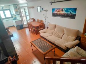 a living room with a couch and a table at El Rincón in Gallegos