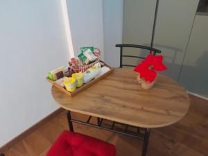 a wooden table with a small table with toys on it at casamiacasatua in Ronciglione +6 photos