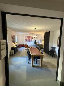 a living room with a table and a dining room at Another World Village house in Buis-les-Baronnies