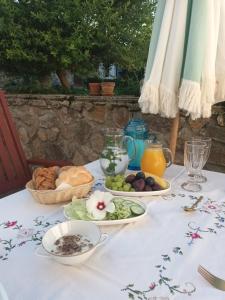 a white table with plates of food on it at Záboří 10 in Záboří