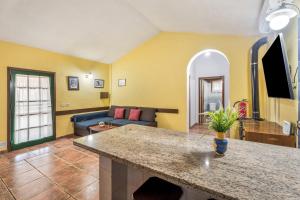 a living room with a couch and a table at vv Casa Rural El Pajar in El Pinar del Hierro
