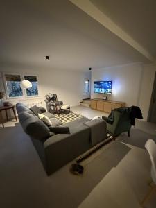a living room with a couch and a flat screen tv at Casa Rural Picape in Pedre