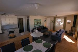 an aerial view of a living room and dining room at Camp Caroli Family House in Jukkasjärvi