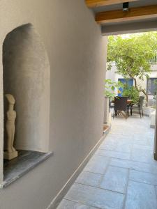 an outside view of a house with a patio at Hercules Historic Apartments in Chalkida