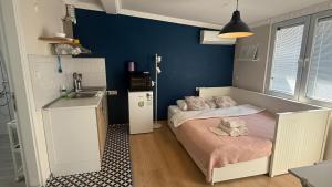 a bedroom with a bed with two teddy bears on it at Sapphire Suites Taksim in Istanbul