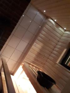 an escalator in a building with a person on it at Pääsky Schwalbe-cabin by crater lake in Varpaisjärvi +18 photos