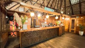 a restaurant with a bar in a building at Hotel Amazon by On Vacation in Leticia