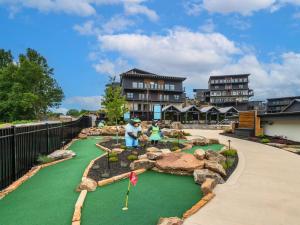 a golf course at a resort with people playing golf at Smith Creek Resort - Exclusive Waterpark Included in Sevierville