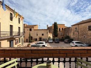 a view of a parking lot with cars parked at VentallóLEscala. WiFi. Rooftop w stunning views in Ventalló