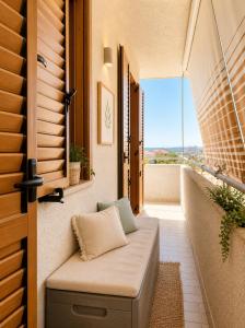 a balcony with a bench with a view at Dimora del Sole in Vasto +7 photos