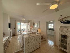 a large bathroom with a sink and a large window at Villa Riells Mar in L'Escala