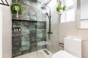 a bathroom with a shower and a toilet at Condo Cabrinha - Kite Beach Cabarete in Cabarete