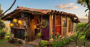 a tiny house in a garden at Aldea Victoria EcoRefugio in Medellín