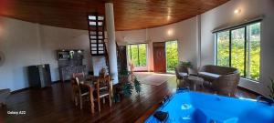 a large living room with a large blue tub at Cinco Elementos Glamping in Chiquinquirá