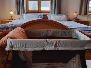 a bedroom with two beds with blue and white at Haiderhof in Schleching