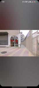 a view of a building with a door and a street at Hotel Manali Villa in Manāli