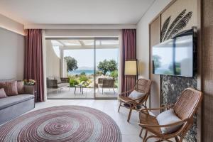 a living room with a couch and chairs at Cala Cuncheddi - VRetreats in Murta Maria