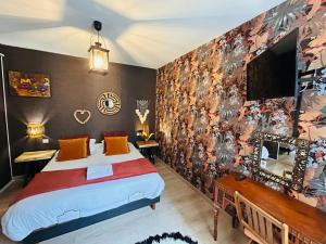 a bedroom with a bed and a wall with a mural at LEtape Prestige Hyper-Centre Calme in Reims