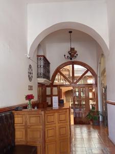 a large room with an archway in a building at Hotel Santa Fe in Tlatlauquitepec