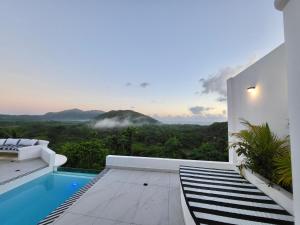 a villa with a pool and a view of the mountains at Villa Blanca only accessible by 4x4 vehicle in El Valle