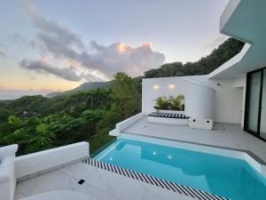 a villa with a swimming pool and a view at Villa Blanca only accessible by 4x4 vehicle in El Valle