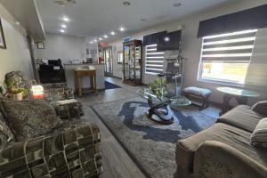 a living room with a couch and a table at OYO Hampton South Carolina Hwy 278 in Hampton-Varnville Airport