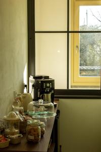 a kitchen with a counter top with food on it at Ai tre camini in Adro