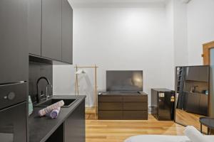 a kitchen with a sink and a counter top at South Beach Studio - Simple Base, Walk Everywhere in South Fremantle