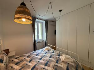 a bedroom with a bed and a large mirror at 11 Apartaclean Cancellieri in Trieste