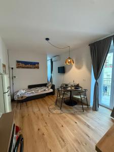 a living room with a couch and a table at 11 Apartaclean Cancellieri in Trieste