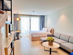 a living room with a couch and a bed at The Cam Ranh Oceanview Resort in Cam Ranh +60 photos
