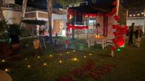 a garden with candles and lanterns on the grass at Cosalá Grand in San Juan Cosalá +90 photos