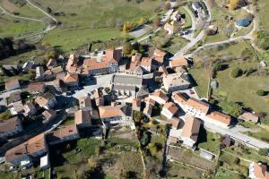 an aerial view of a small town with houses at Maisonnette ardéchoise au centre du village in Nozières +8 photos