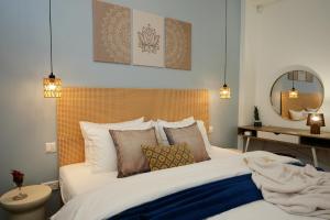 a bedroom with a large white bed with pillows at Zen Loft Quiet Retreat near St julians in Is-Swieqi